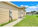 Charming home exterior with a well-maintained lawn and inviting entrance at 4649 College Dr, Orlando, FL 32811