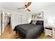 This bedroom boasts wood-look floors and a ceiling fan at 467 Weston Manor Dr, The Villages, FL 32162