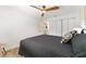 This bedroom offers wood-look flooring, white walls, and ample space at 467 Weston Manor Dr, The Villages, FL 32162