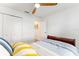 Bright bedroom with ample closet space and modern ceiling fan offers comfort and functionality at 467 Weston Manor Dr, The Villages, FL 32162