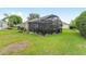 The home's screened-in patio extends the living space and offers a private retreat within the lush backyard setting at 467 Weston Manor Dr, The Villages, FL 32162