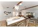 Spacious living room with wood beams, modern light fixture, and beautiful decor at 467 Weston Manor Dr, The Villages, FL 32162