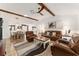 Open concept living room and dining room with hardwood floors and natural light at 467 Weston Manor Dr, The Villages, FL 32162
