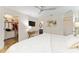 The main bedroom boasts wood-look flooring, a ceiling fan, and a walk-in closet at 467 Weston Manor Dr, The Villages, FL 32162