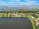 Aerial view of waterfront properties, highlighting the calm lake and well-maintained community at 4835 Calasans Ave, St Cloud, FL 34771