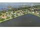 Stunning aerial showcasing lakeside homes with pristine lawns and serene water views at 4835 Calasans Ave, St Cloud, FL 34771