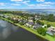Aerial image of waterfront community, displaying homes with pools and stunning lakefront access at 4835 Calasans Ave, St Cloud, FL 34771