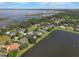 Gorgeous aerial view of waterfront homes, featuring lush landscaping and lake access at 4835 Calasans Ave, St Cloud, FL 34771