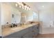 Spacious bathroom with double vanity, granite countertops, and separate tub and shower at 4835 Calasans Ave, St Cloud, FL 34771