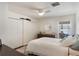 Bright bedroom with a ceiling fan, large closets, and a view of the water at 4835 Calasans Ave, St Cloud, FL 34771