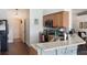 Well-lit kitchen featuring granite counters, modern appliances, and breakfast bar seating at 4835 Calasans Ave, St Cloud, FL 34771