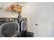 Laundry room with modern washer and dryer and ample storage space at 4835 Calasans Ave, St Cloud, FL 34771