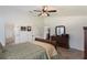 Main bedroom showcasing tile floors, and a charming en-suite bath at 4835 Calasans Ave, St Cloud, FL 34771
