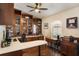 Home office featuring custom cabinetry, granite countertops, and a built-in desk at 4835 Calasans Ave, St Cloud, FL 34771