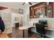 Spacious home office with built-in shelving, custom desk, and ample natural light at 4835 Calasans Ave, St Cloud, FL 34771