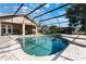 Stunning screened-in pool with ample deck space and lush landscaping around the perimeter at 4835 Calasans Ave, St Cloud, FL 34771