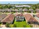 Lovely aerial view of this two-story home in a well-maintained neighborhood with green lawns and mature trees at 4869 Grassendale Ter, Sanford, FL 32771