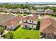This aerial view highlights the home's position on a well maintained lot with manicured lawn at 4869 Grassendale Ter, Sanford, FL 32771