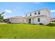 Large backyard with green lawn, plenty of space, and rear porch at 4869 Grassendale Ter, Sanford, FL 32771