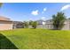 Large fenced backyard perfect for entertaining with a beautiful lawn and mature trees at 4869 Grassendale Ter, Sanford, FL 32771