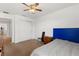 Bedroom features a ceiling fan, natural light and doorway view along with a large closet at 4869 Grassendale Ter, Sanford, FL 32771