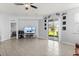Bright living room with neutral walls, recessed lighting, and sliding glass doors leading to the backyard at 4869 Grassendale Ter, Sanford, FL 32771