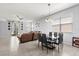 Open-concept living room and dining area featuring tile floors, neutral walls, and lots of natural light at 4869 Grassendale Ter, Sanford, FL 32771