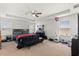 Spacious main bedroom with lots of natural light, ceiling fan, and ensuite bathroom at 4869 Grassendale Ter, Sanford, FL 32771