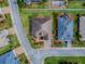 Aerial view of the property showcasing the neatly landscaped yard and convenient street access at 4976 Sandpiper Dr, Oxford, FL 34484