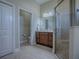 The bathroom includes tile floors, a walk-in shower, and a sink with a vanity at 4976 Sandpiper Dr, Oxford, FL 34484