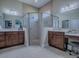 This bathroom features tile floors, a glass shower, and dual vanity sinks at 4976 Sandpiper Dr, Oxford, FL 34484