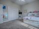 This bedroom has carpet flooring, light walls, and a closet at 4976 Sandpiper Dr, Oxford, FL 34484