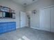 This bedroom features carpet, a blue dresser, and a basketball hoop by the closet at 4976 Sandpiper Dr, Oxford, FL 34484