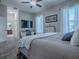 This bedroom has carpet flooring, neutral walls, and a television at 4976 Sandpiper Dr, Oxford, FL 34484