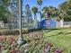 Welcoming entrance to Lakeside Landings with lush landscaping and elegant signage at 4976 Sandpiper Dr, Oxford, FL 34484