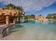 Inviting community pool showcasing a rock structure and clear, blue water at 4976 Sandpiper Dr, Oxford, FL 34484