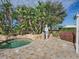 Community spa features lush tropical plants and a beautiful stone surround at 4976 Sandpiper Dr, Oxford, FL 34484