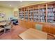 Community library with built-in shelving and an array of reading material at 4976 Sandpiper Dr, Oxford, FL 34484