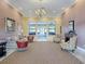 Beautiful clubhouse lounge offering plush seating and decorative fireplace at 4976 Sandpiper Dr, Oxford, FL 34484