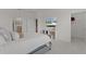 Relaxing bedroom featuring a wall-mounted TV and ample storage at 5043 Stokes Way, Wildwood, FL 34785