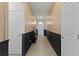Elegant hallway featuring wainscoting and designer wallpaper at 5043 Stokes Way, Wildwood, FL 34785