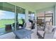 The beautiful screened lanai, perfect for entertaining or relaxing with scenic backyard views at 5043 Stokes Way, Wildwood, FL 34785