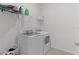 Practical laundry room equipped with modern washer and dryer units at 5043 Stokes Way, Wildwood, FL 34785