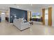 Inviting living room with modern furniture, a cozy seating arrangement, and contemporary decor at 5043 Stokes Way, Wildwood, FL 34785