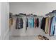 Spacious walk-in closet with ample shelving and hanging space for organized storage at 5043 Stokes Way, Wildwood, FL 34785