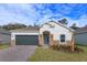 Charming single-story home with a well-manicured lawn and stone accents, offering great curb appeal at 5045 Balsam Falls Rd, Deland, FL 32724