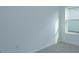 A sunlit room shows clean painted walls and trim with a window to the exterior of the home at 5045 Balsam Falls Rd, Deland, FL 32724