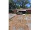 Cozy brick ranch-style home with awning and mature trees on a spacious lot at 5643 County Road 173, Wildwood, FL 34785
