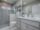 Bathroom featuring a glass shower, vanity with sink, and modern finishes at 5905 Caulk Ct, The Villages, FL 32163