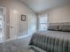 Bedroom with a large bed, grey carpet, closet and window at 5905 Caulk Ct, The Villages, FL 32163